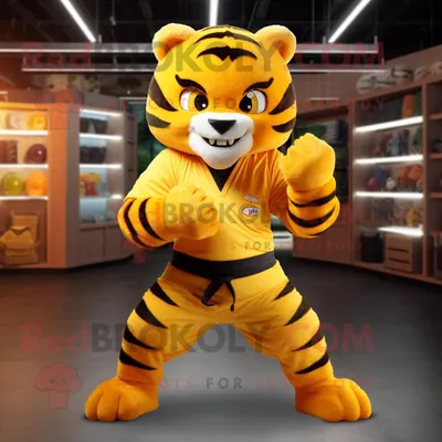 Produktbild von Gelber REDBROKOLY Tiger Maskottchen Kostüm charakter bekleidet mit einem Overall und Gürteln
