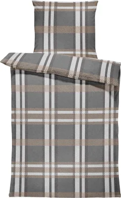 A folded duvet cover and pillowcase set with a plaid pattern.