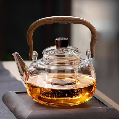 Image de Théière en verre avec infuseur amovible, capacité de 1 litre. Théière en verre transparent, résistante à la chaleur, idéale pour infuser du thé en feuilles, des tisanes et des infusions