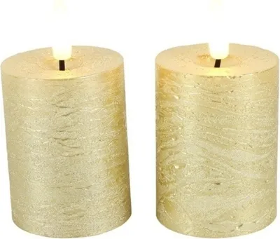Two gold LED pillar candles are shown against a white background.