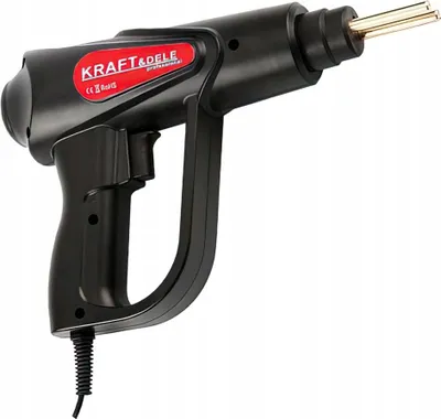 A black plastic device with a red label and gold metal prongs, shown against a white background.