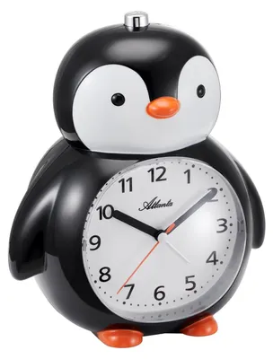 A close-up studio shot of a black and white penguin alarm clock.