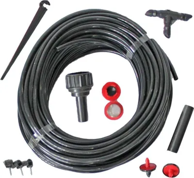 A collection of drip irrigation system components laid out on a white background.