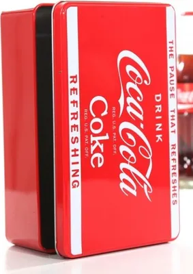 A close-up shot of a red Coca-Cola storage tin.