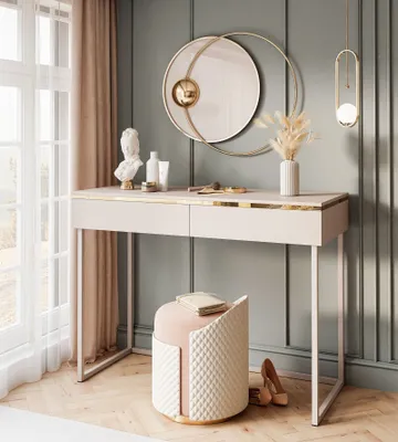 A modern vanity table set with a stool in a bedroom.
