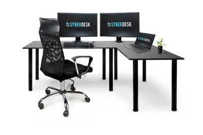 A black L-shaped desk with two monitors, a laptop, a keyboard, a mouse, and a black office chair, all on a white background.