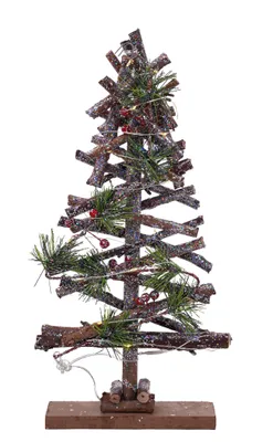 A decorative Christmas tree made of twigs, adorned with pine sprigs, red berries, and LED lights, standing on a wooden base.
