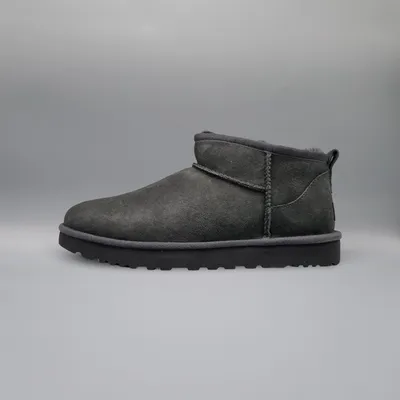 A single Ugg boot is shown against a plain gray background.