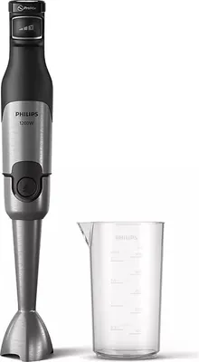 A hand blender and a measuring cup are shown against a white background.
