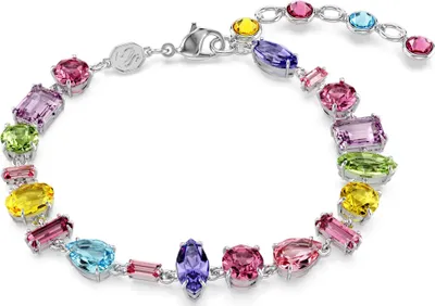 A close-up studio shot of a colorful gemstone bracelet.