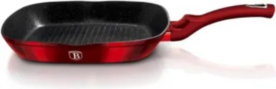 A red grill pan with a black interior and a red handle, shown from a side angle on a white background.