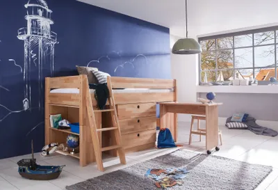 A child's bedroom with a loft bed and desk, decorated with a lighthouse mural.
