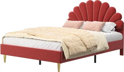 A red upholstered bed with a fan-shaped headboard and gold legs, shown with beige and pink bedding.