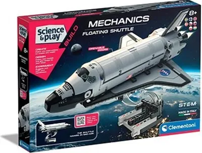 The image shows the product packaging for a Clementoni Science & Play Build Floating Shuttle model kit, set against a background depicting Earth and space.
