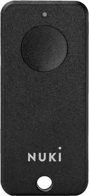 A black Nuki remote control is shown against a white background.