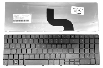 A laptop keyboard and its internal components are displayed against a white background.
