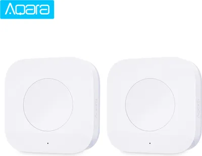 Two white Aqara wireless mini switches are shown on a white background.