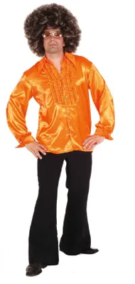 A man wearing a 70s-style disco outfit, including an orange ruffled shirt, black bell-bottom pants, and an afro wig.