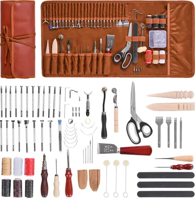 A collection of leatherworking tools laid out on a white background.