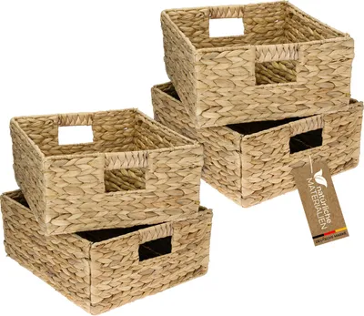Four woven storage baskets stacked and arranged.