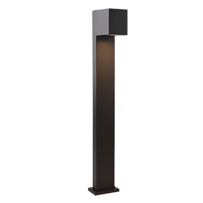 A modern, dark gray outdoor lamp with a square top and a tall, rectangular base, set against a white background.