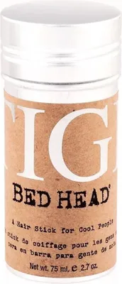 A close-up studio shot of a Tigi Bed Head hair styling stick.