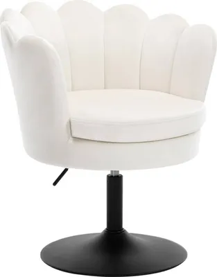 A white velvet chair with a scalloped back and a black metal base.