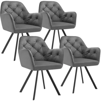Four gray velvet armchairs arranged in a staggered formation against a white background.