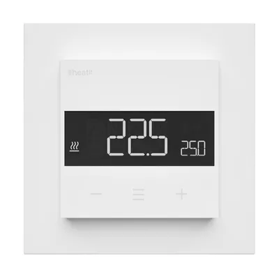 A white thermostat mounted on a white wall plate.