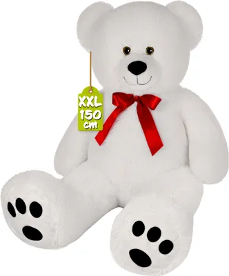 A large white teddy bear with a red bow and a size tag.