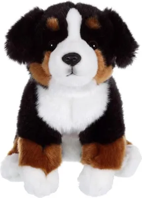 A plush toy dog sitting on a white background.
