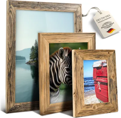 Three wooden picture frames of different sizes are displayed against a white background. The largest frame on the left contains a landscape image of a lake and trees. The middle frame shows a close-up of a zebra's face. The smallest frame on the right feat