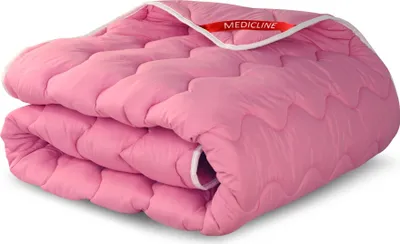 A folded pink comforter is shown against a white background.