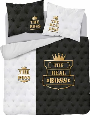 A bedding set with a split design, featuring black and white sections with gold text and crown graphics.