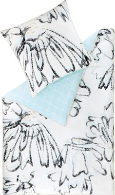 A bedding set with a floral pattern and a light blue pillow.