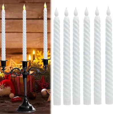 A set of white LED taper candles displayed in a black candelabra on a wooden surface with Christmas decorations.