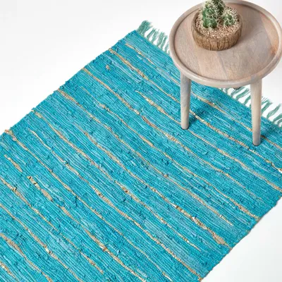Produktbild von HOMESCAPES Glitzer-Lederteppich türkis-gold 90x150 cm, Handwebteppich aus