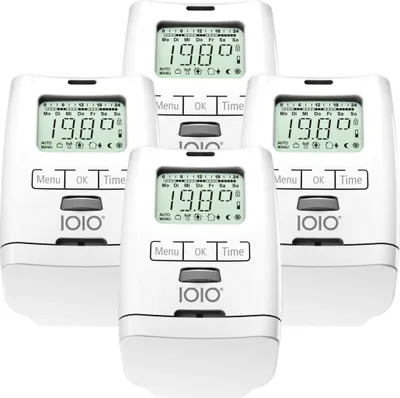 A group of four electronic radiator thermostats arranged in a cluster.