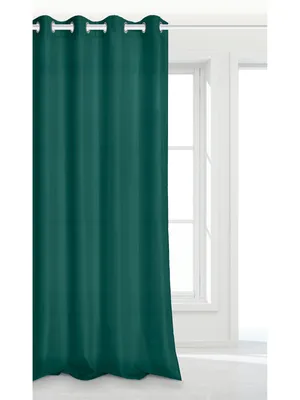 A dark green curtain hangs in front of a white-framed window.