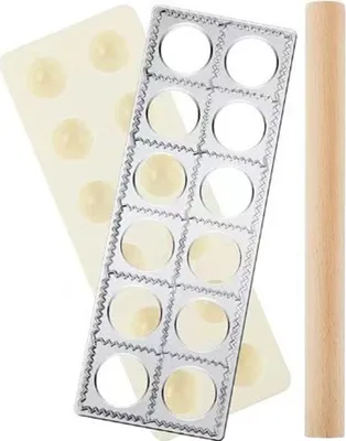 A set of tools for making pasta or dumplings, including a ravioli stamp, a mold, and a rolling pin.