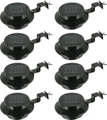 A grid of eight black solar-powered gutter lights, each with a solar panel on top and a mounting bracket.