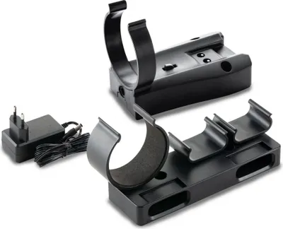 A black charging dock and a black power adapter are displayed on a white background.