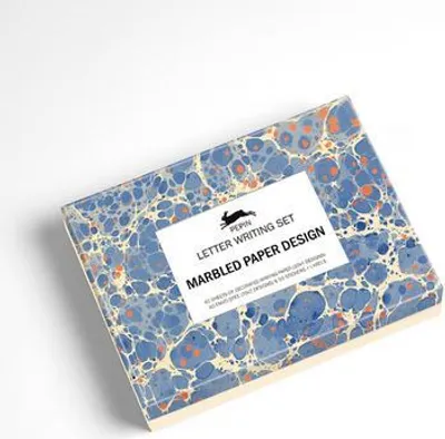 A writing set with marbled paper design is shown on a white background.