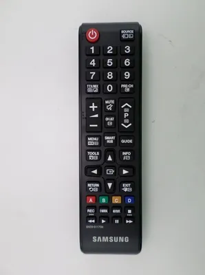 A black Samsung remote control is shown against a light gray background.