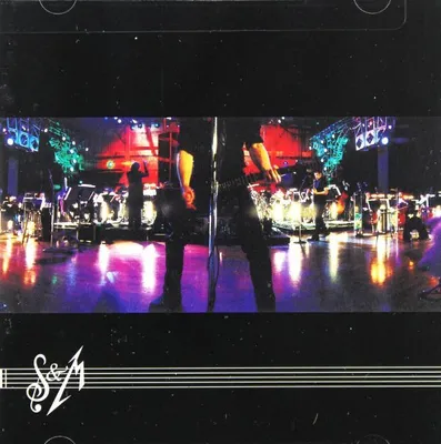A live concert performance with musicians and stage lighting.