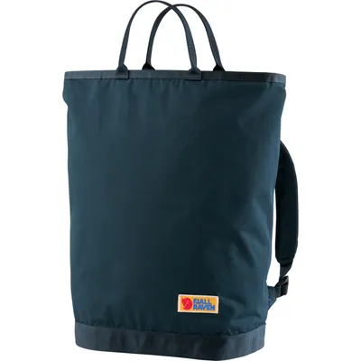 A dark blue tote bag with handles and a shoulder strap is shown against a white background.