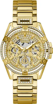 A close-up studio shot of a gold Guess watch.