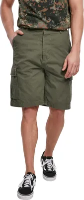 A man wearing cargo shorts and a camouflage t-shirt.