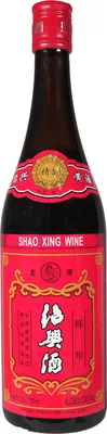 A bottle of Shao Xing wine against a white background.