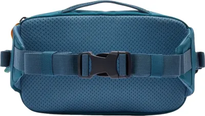 The back of a teal hip pack with a black buckle and strap.